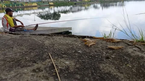 A man is fishing 스톡 동영상 157568520