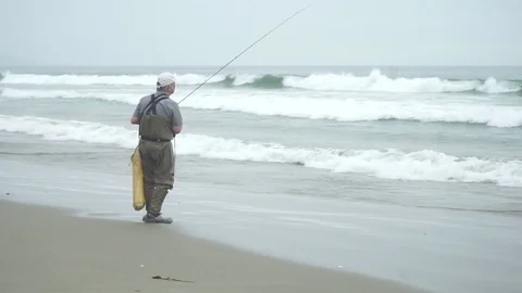 Man Fishing in ocean Stock Footage