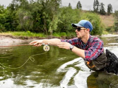 Man fishing in river, Clark Fork, Montana and Idaho, US Stock Photos