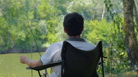 Man fishing in river 스톡 동영상 82724169
