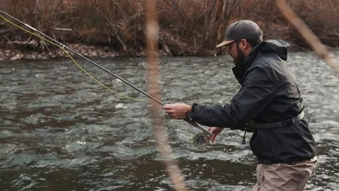 Man Fishing In A River Stock Footage 83598397