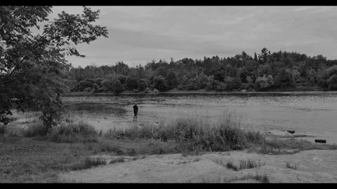 Man fishing on a river Stock Footage 277964826