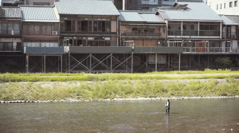 A man fishing on the river in Kyoto Janpan Stock Footage