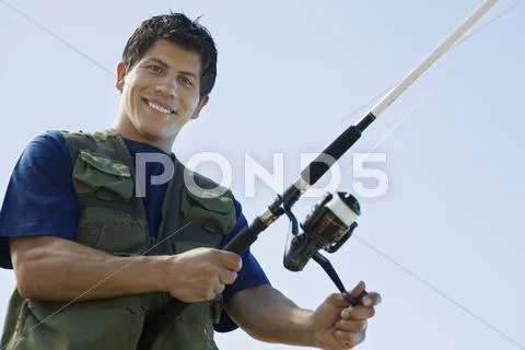 Man With Fishing Rod Stock Photos