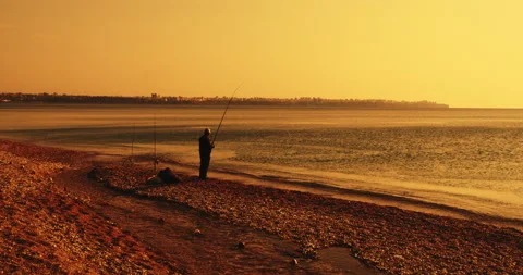 Man fishing at sunset 스톡 동영상 142672995