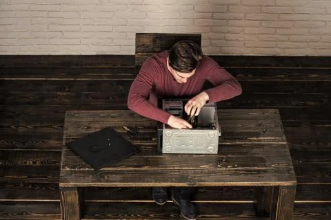 Man fix computer device or printer Stock Photos