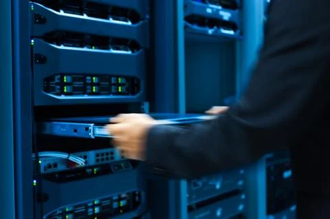 Man fix server network in data center room Stock Photos