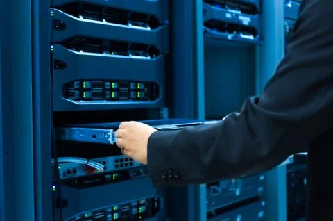 Man fix server network in data center room Stock Photos