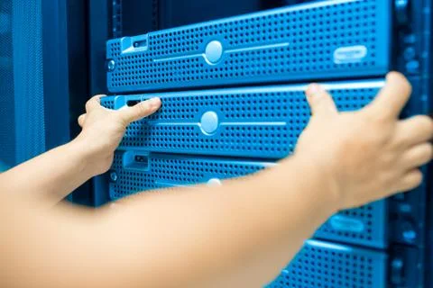 Man fix server network in data center room Stock Photos