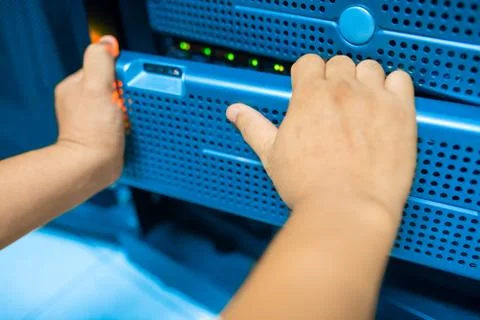 Man fix server network in data center room Stock Photos