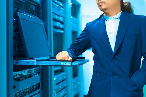Man fix server network in data center room Stock Photos