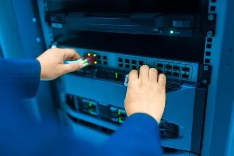 Man fix server network in data center room Stock Photos