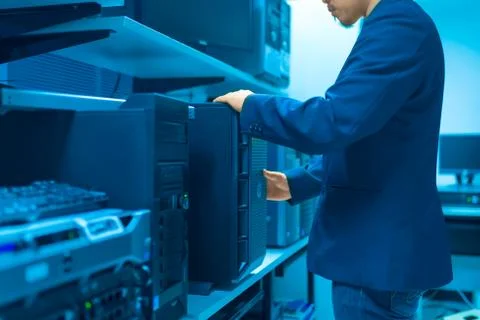 Man fix server network in data center room Stock Photos