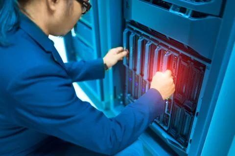 Man fix server network in data center room Stock Photos