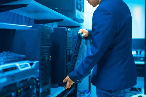 Man fix server network in data center room Stock Photos