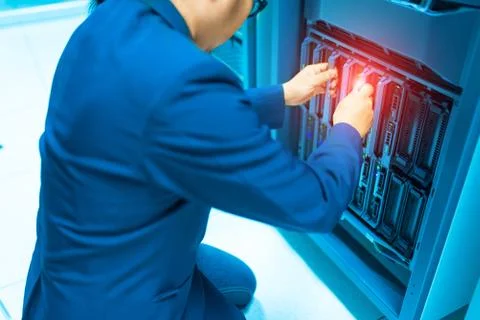 Man fix server network in data center room Stock Photos