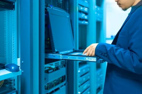 Man fix server network in data center room Stock Photos
