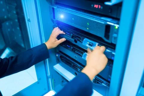 Man fix server network in data center room Stock Photos