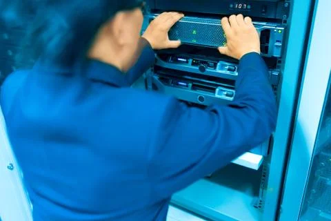 Man fix server network in data center room Stock Photos