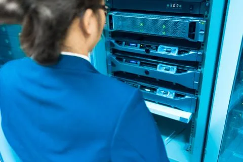 Man fix server network in data center room Stock Photos