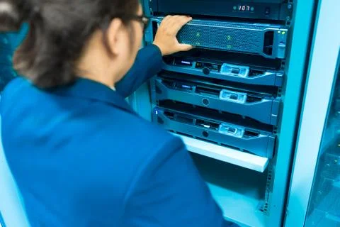 Man fix server network in data center room Stock Photos