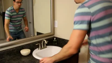 Man Fixes Hair Stock Footage 18178682