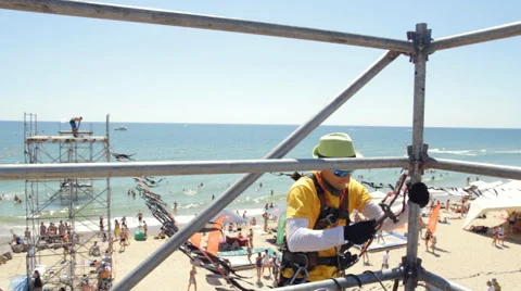 Man in Fixes Scaffold Beats Hammer Stock Footage 66304439