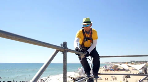 Man in Fixes Scaffold Beats Hammer Video stock 66304466