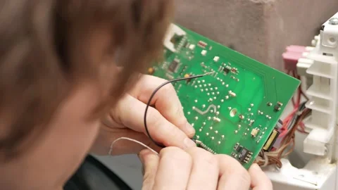 Man fixes washing machine, repairs, broken, destroyed. Bathroom, tools, repair 库存影片 168375491