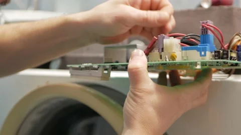 Man fixes washing machine, repairs, broken, destroyed. Bathroom, tools, repair Video stock 168375509