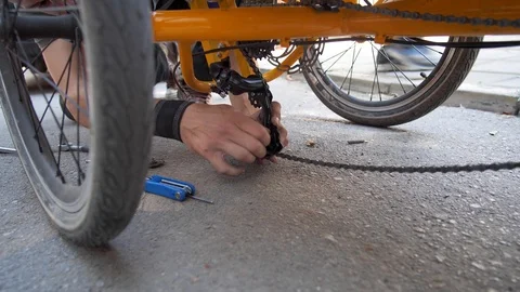 A Man Fixing a Broken Rickshaw Stock Footage 102627666