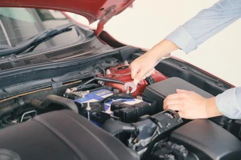 A man fixing the car engine with copy space.. Stock Photos