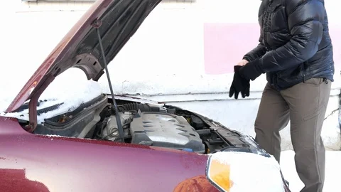 Man fixing car with opened hood Stock Footage 100855975