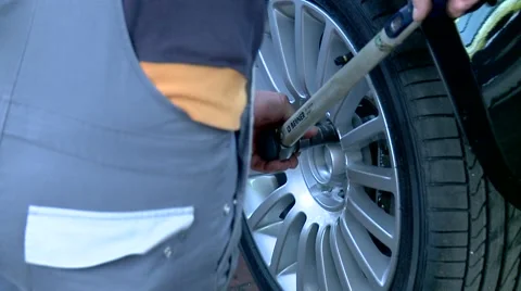 Man fixing Car tire Stock Footage 45658188