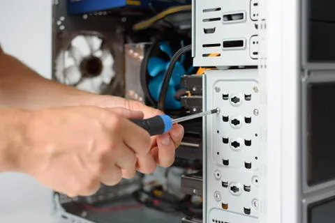 A man fixing a computer. Closeup Stock Photos
