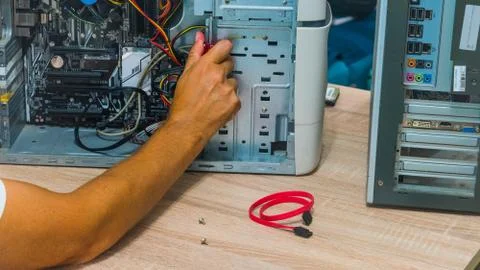Man fixing a computer Stock Photos