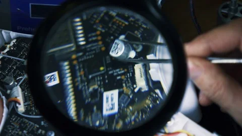 Man fixing a crashed drone. Tracking shot. Close up. 4K Stock Footage 86914291