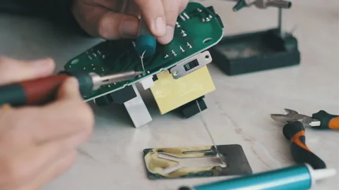Man is fixing a electronic power unit with a soldering Video stock 166046695