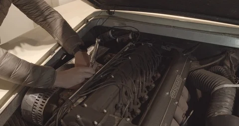 Man Fixing The Engine Of A Vintage Car Stock Footage 115558743