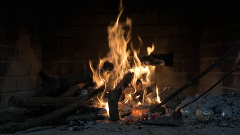 A Man Is Fixing A Fire In A Fireplace (Hd) Stock Footage 102277312