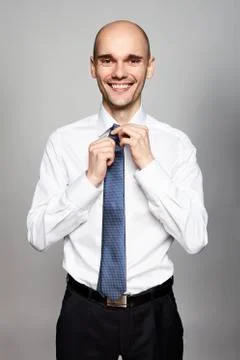 Man Fixing His Tie Stock Photos