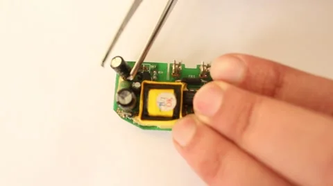 Man is fixing micro scheme processor hardware chip with the tweezers 스톡 동영상 47028832