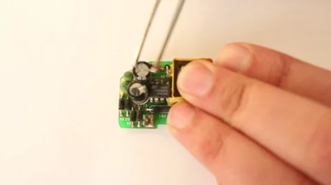 Man is fixing micro scheme processor hardware chip with the tweezers Stock Footage 47028884