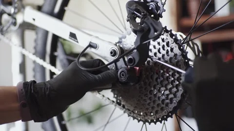 Man fixing a mountain bike in a workshop Stock Footage 277968598