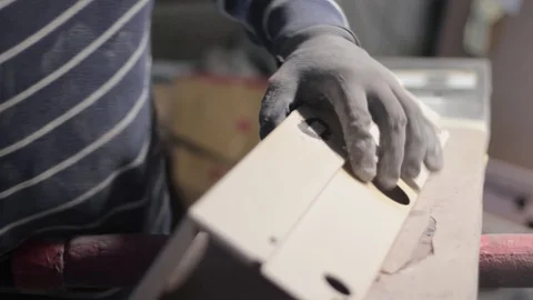 Man fixing plastic part Stock Footage 129023066