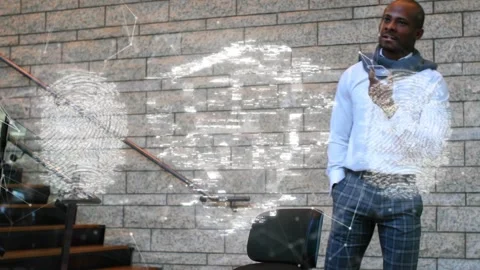 Man fixing scarf while security shield overlaying him with padlock and print Stock Footage 334115671