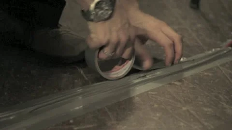 Man fixing a scotch tape Stock Footage