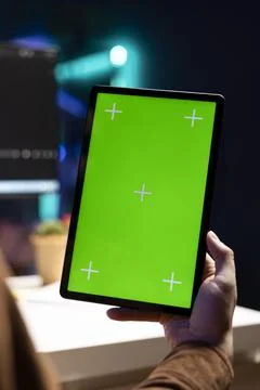 Man fixing security exposures in PC system, writing code on chroma key tablet Foto stock