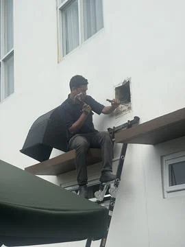 Man fixing a wall Stock Photos