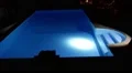 Man with Flashlight Inspects Pool at Night. HD Footage